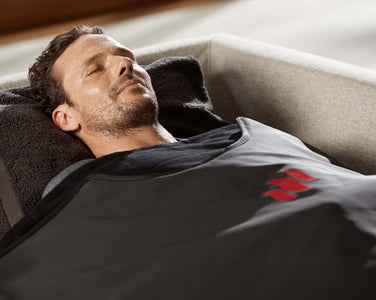 Man enjoying the infrared sauna blanket
